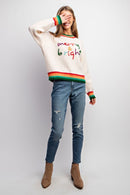 Model wearing Merry & Bright holiday sweater with colorful embroidery and striped rib trim — Social Dizfunksion Clothing Co.