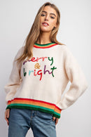 Model wearing Merry & Bright holiday sweater with colorful embroidery and striped rib trim — Social Dizfunksion Clothing Co.
