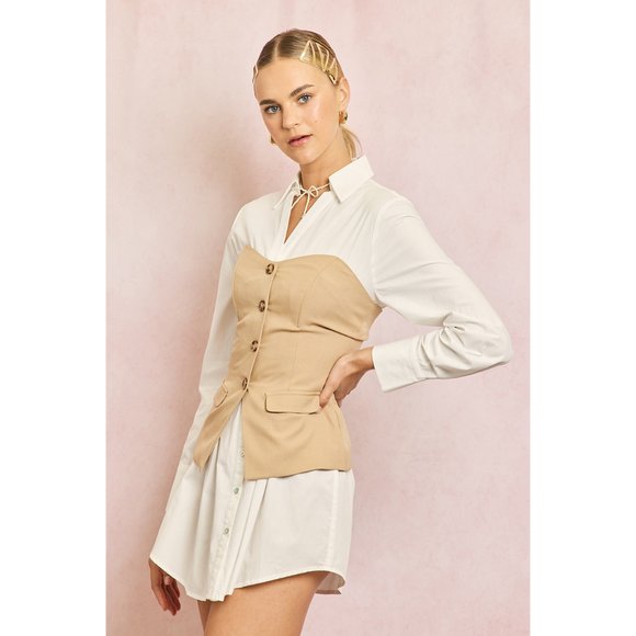 Woman wearing a white shirt and beige vest over a white skirt on a pink background