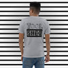 Ash Gray Short Sleeve T-Shirt. The word "TOOL" written across shoulders with the "O's" replaced with outline of peaches. The word sits on top of a black box with the word "SHED" done in a white outline written in the box.