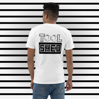 White Short Sleeve T-Shirt. The word "TOOL" written across shoulders with the "O's" replaced with outline of peaches. The word sits on top of a black box with the word "SHED" done in a white outline written in the box.